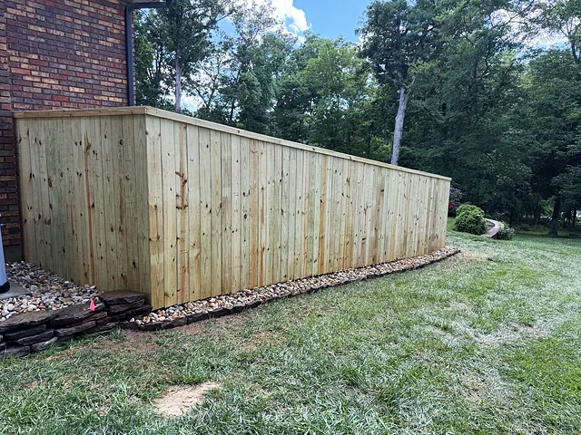 Rock drainage bed on a new fence line