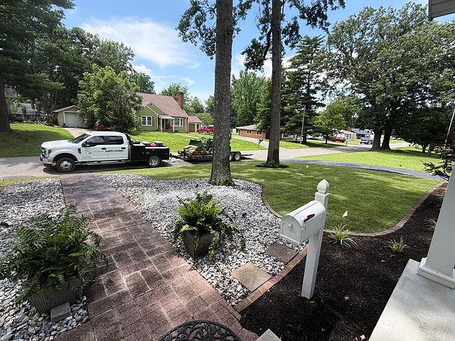Brick walk, rock bed and planters